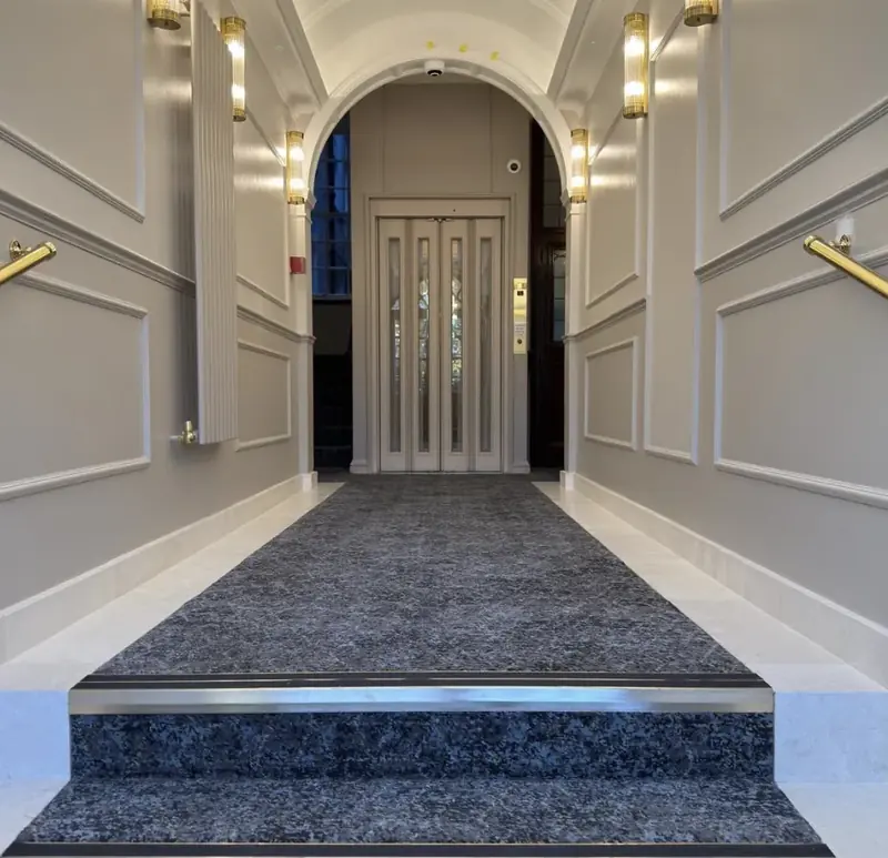 Refurbished entrance lobby with brass wall lights, Hanover House