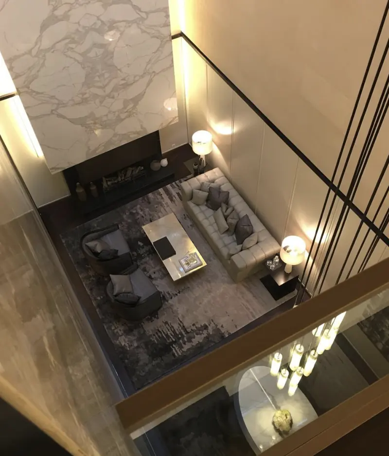Stairwell with black balustrade and pale walls